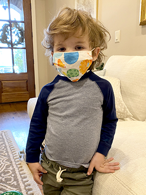 Child displaying children's size mask.